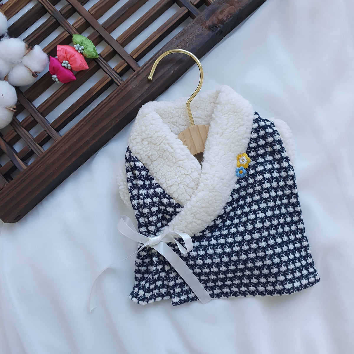 Navy blue and white houndstooth pet hanbok vest with white faux fur collar and side bow detail
