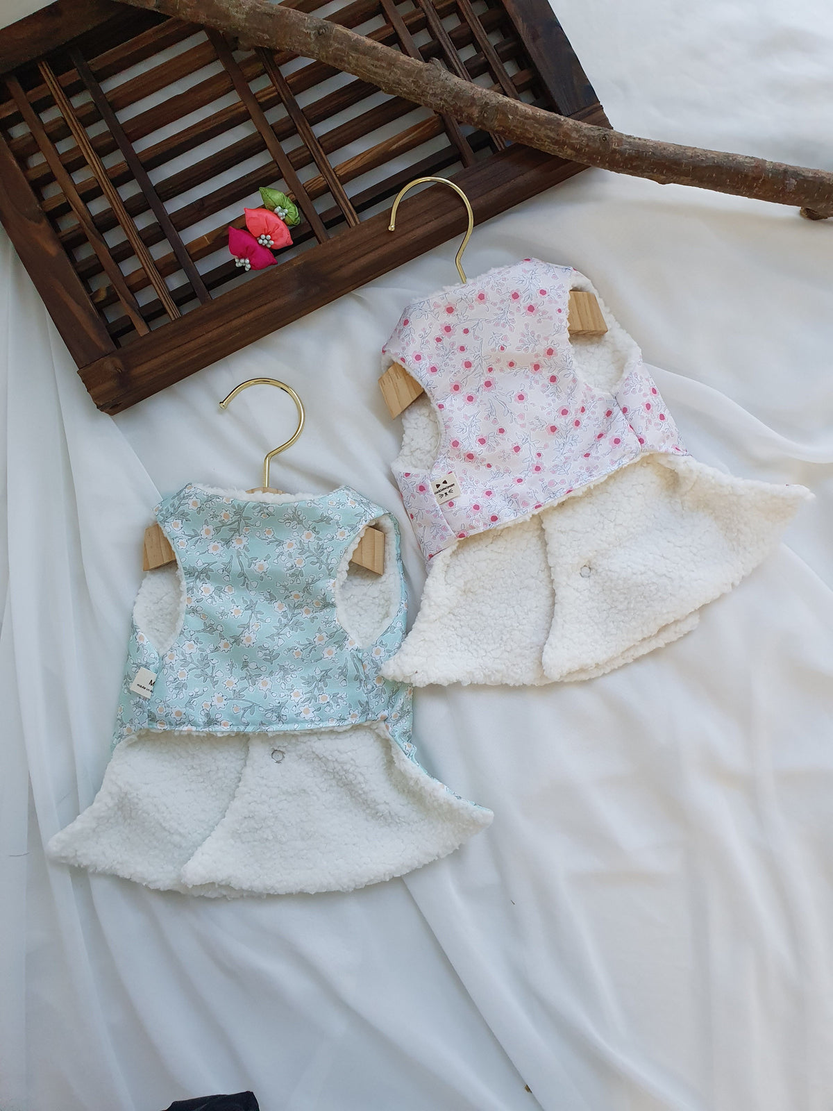 Floral fleece pet hanbok vests in light blue and pink patterns by NKpup.