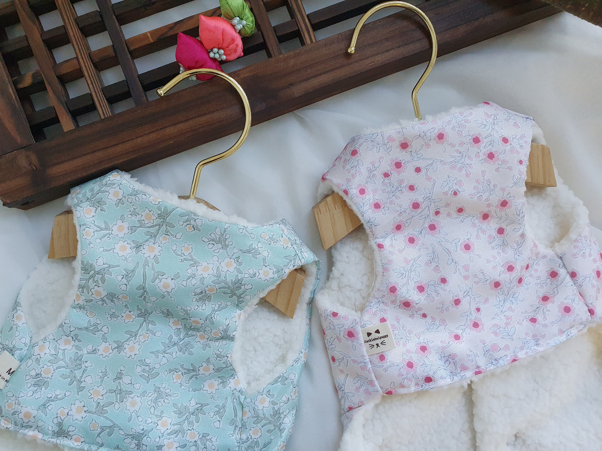 Floral fleece pet hanbok vests in light blue and white with pink floral patterns by NKpup