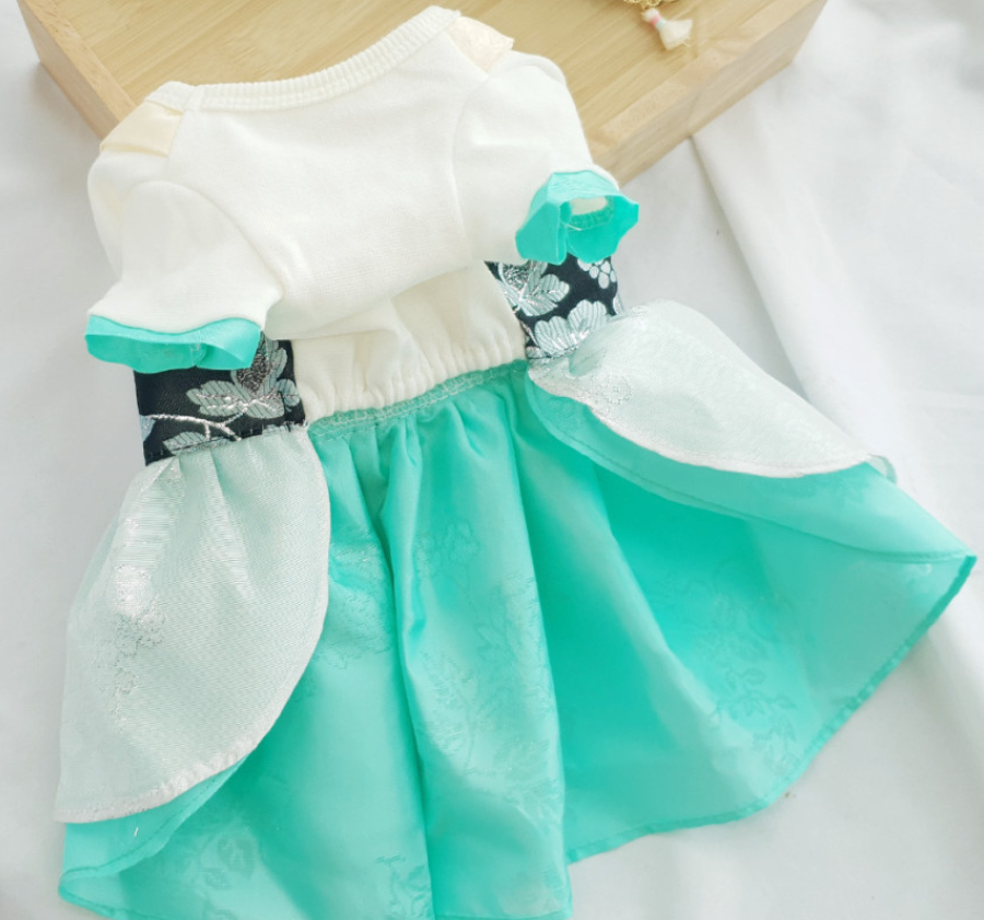 White and mint green pet hanbok dress with silver floral embroidery and a flowing skirt.