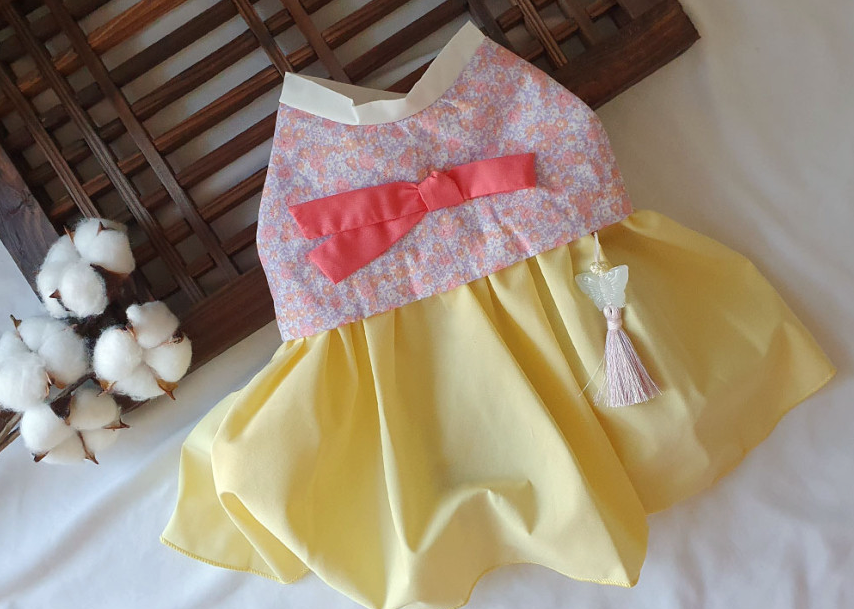 NKpup floral bow pet hanbok with a pink floral top, yellow skirt, and norigae tassel