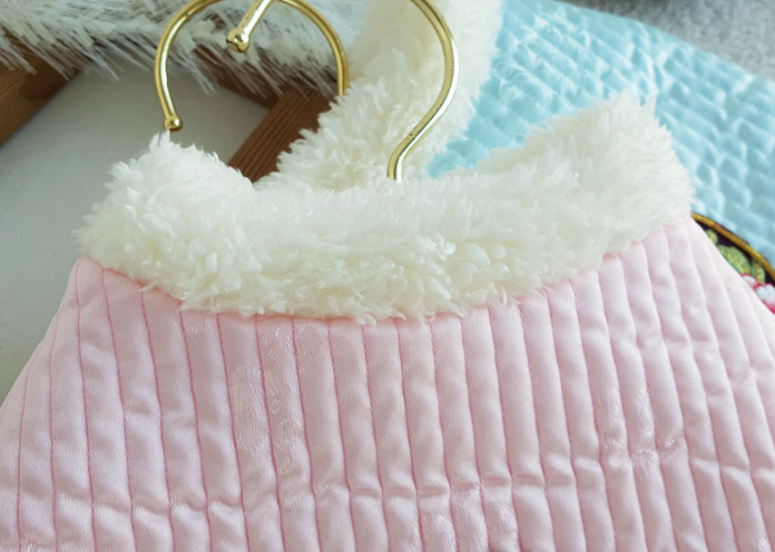 Pastel pink quilted pet hanbok vest with white faux fur trim
