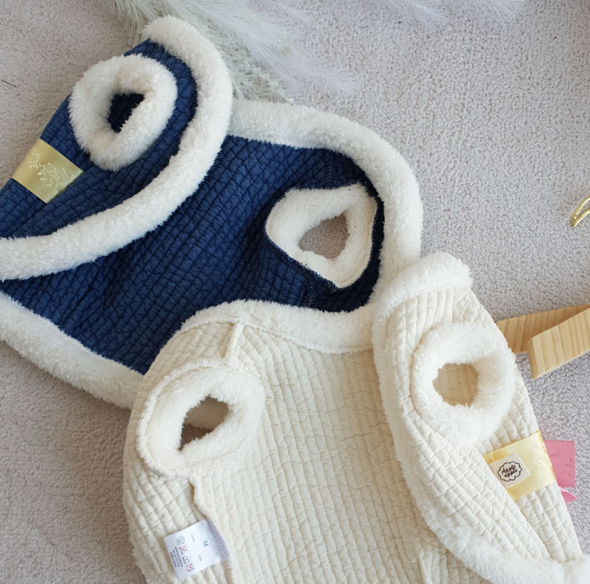 Blue and cream cotton quilted pet hanbok vests with soft faux fur trim.