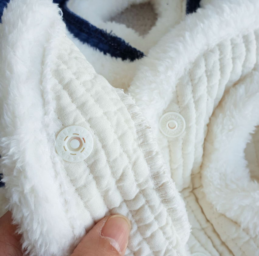 White quilted cotton vest pet hanbok with soft fleece trim and snap buttons.