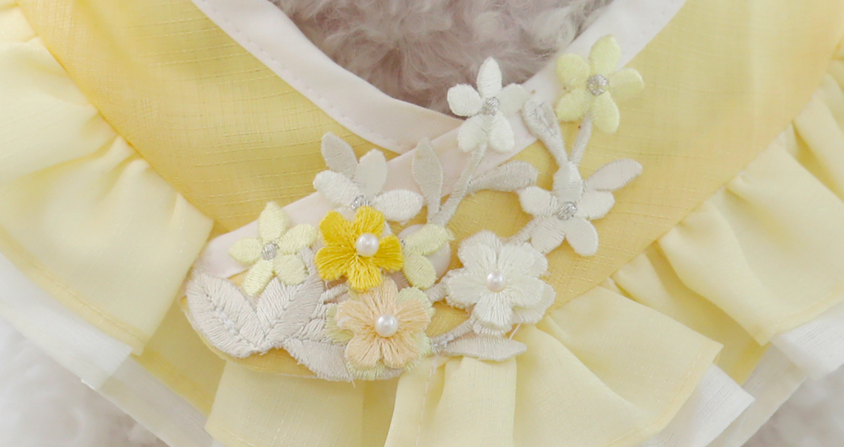 Yellow floral ruffle pet hanbok cape with white and yellow flower embroidery.