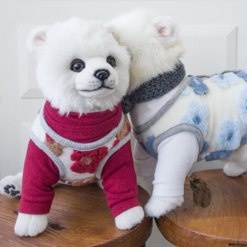 NKpup floral fleece dog vest in red with flower patterns and a blue floral fleece dog vest.