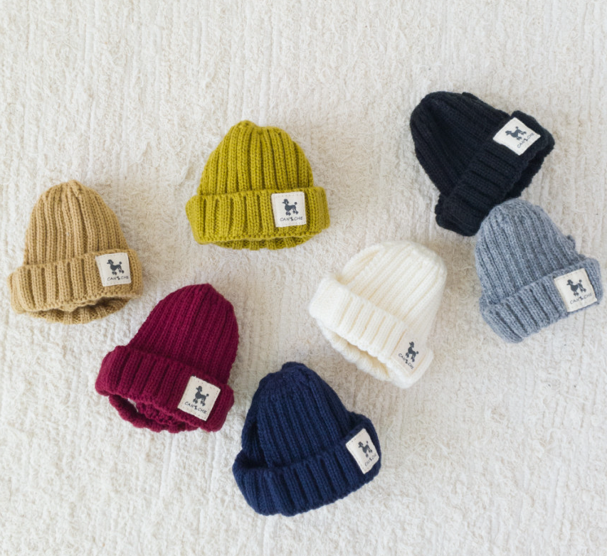 Six NKpup Ribbed Cuff Dog Beanies in tan, olive, navy, burgundy, cream, and grey.