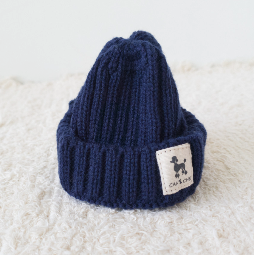 Navy blue ribbed cuff dog beanie by NKpup with a small logo patch.