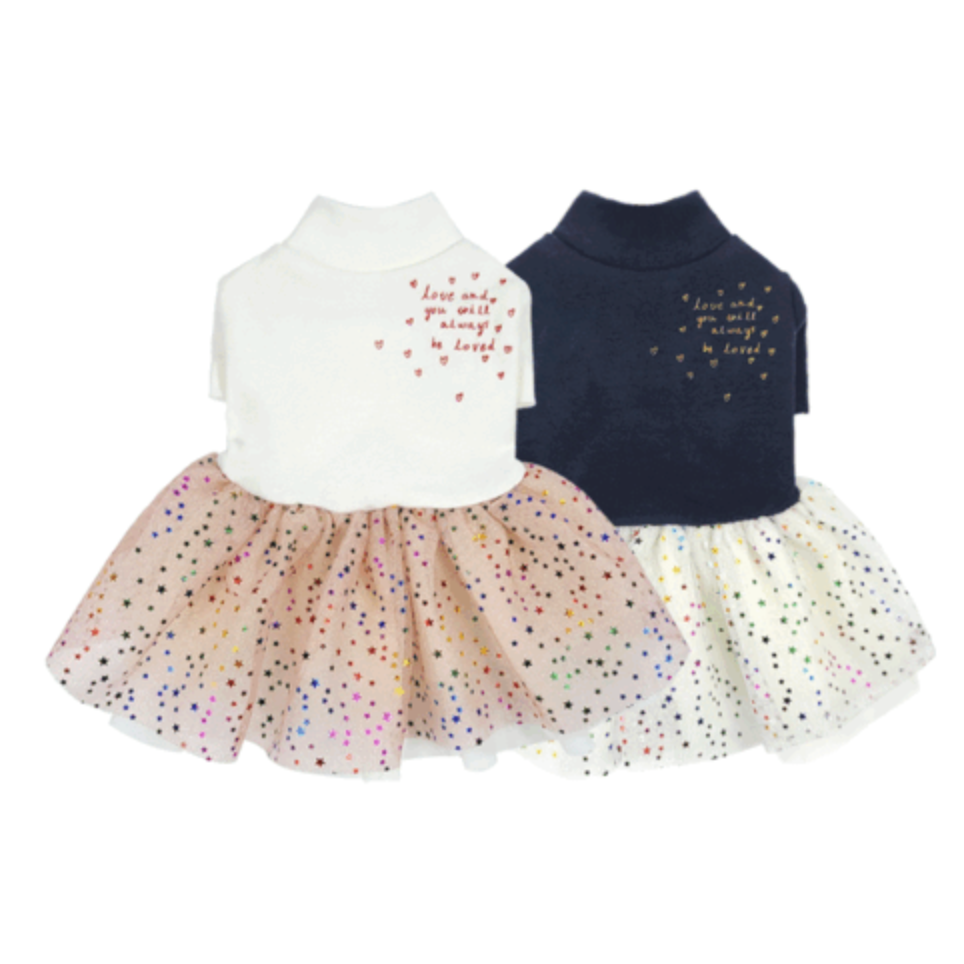 Two Halloween dog tutu dresses, one white and one navy, featuring starry tulle skirts and embroidered text.