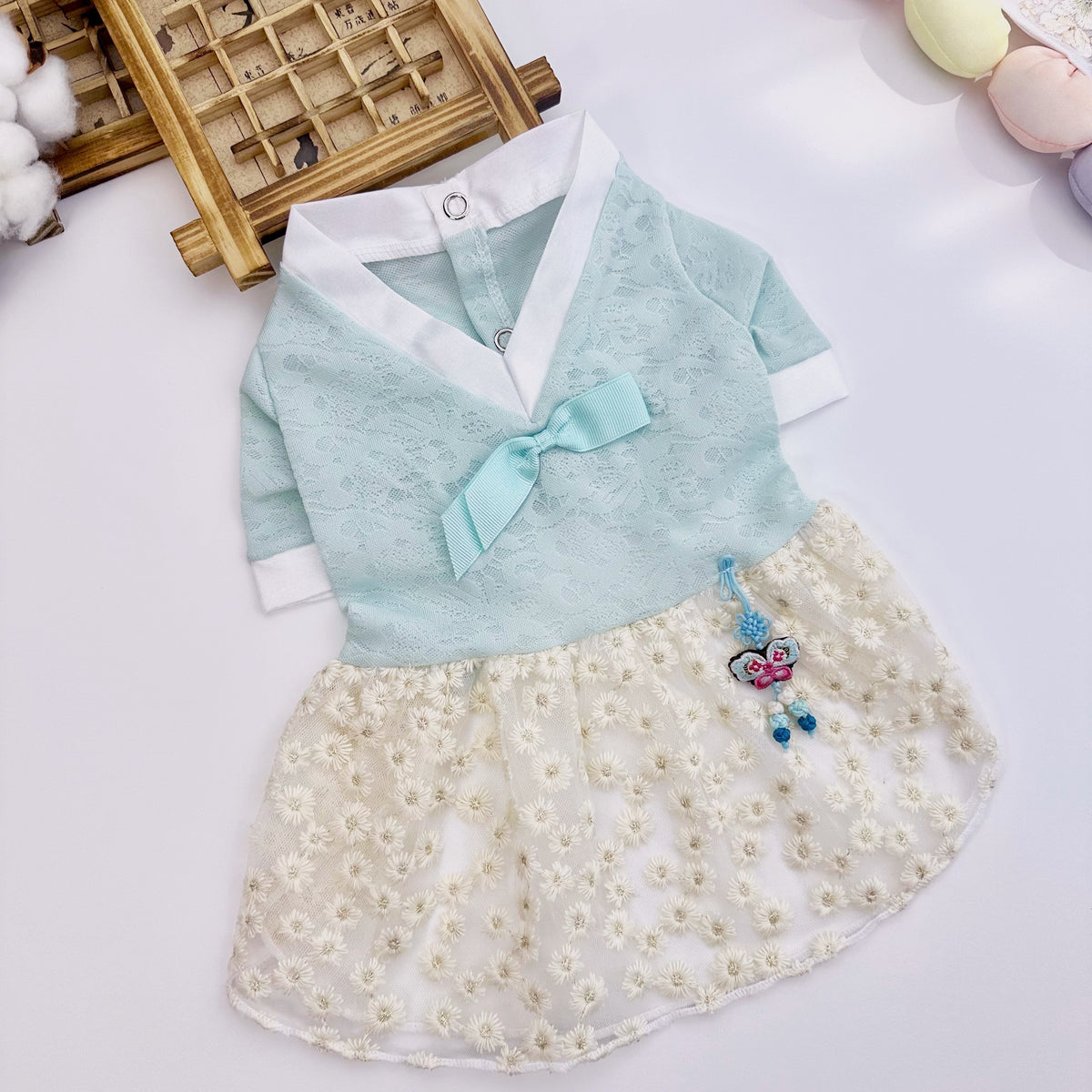 Light blue lace floral pet hanbok with a white skirt and decorative norigae by NKpup