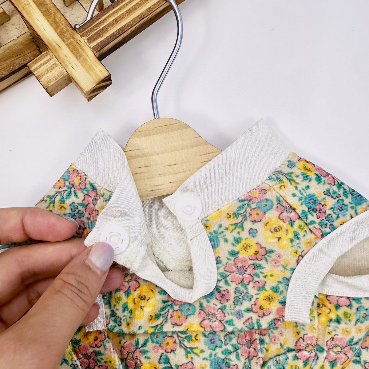 Close-up of NKpup retro floral pet hanbok with white collar and snap buttons
