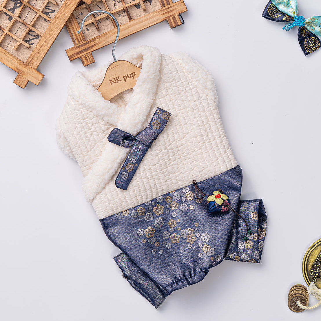 Dog outfit with floral pattern on a light gray background