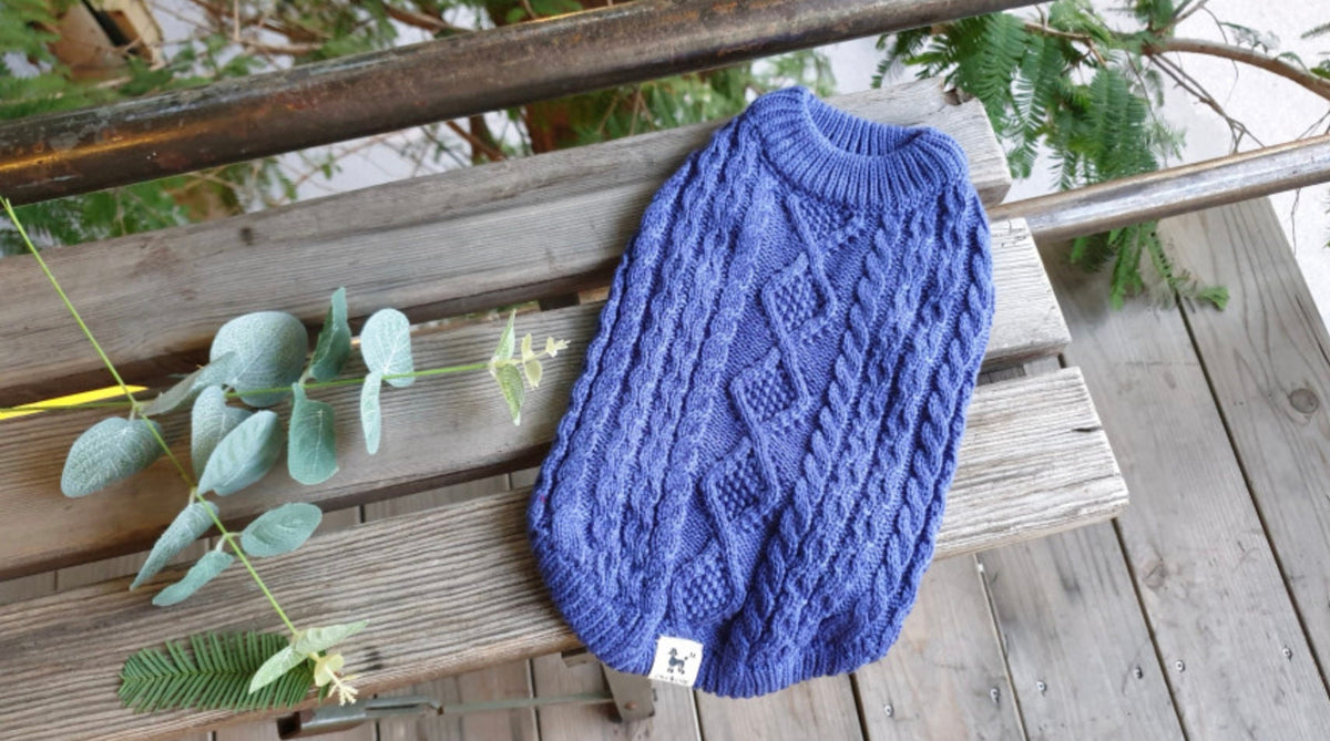 Blue round cable knit dog vest with diamond pattern