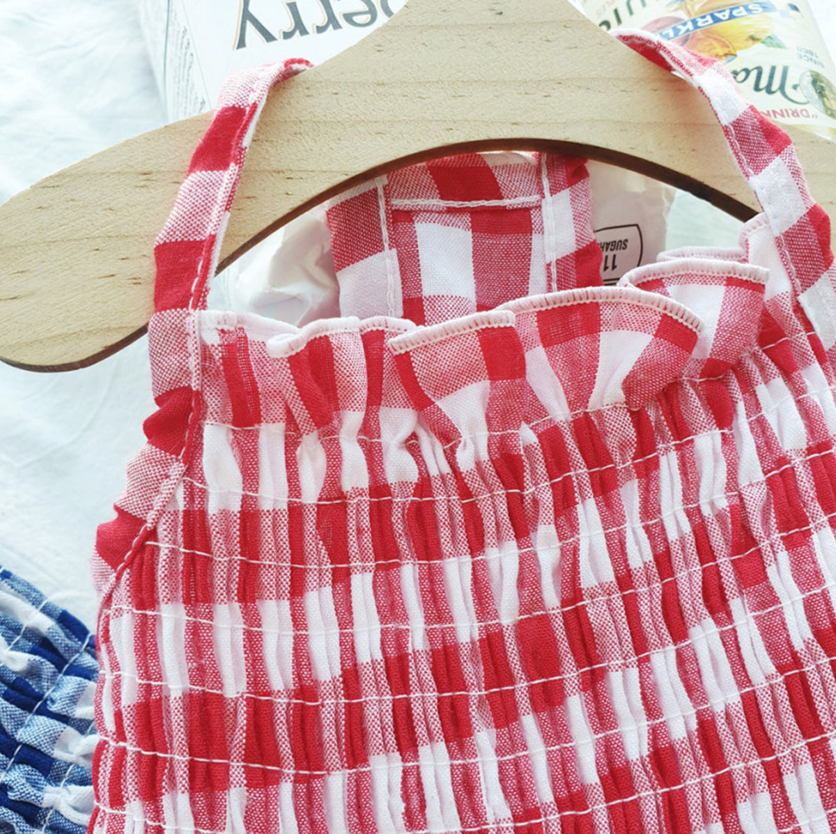 Red and white gingham smocked dog dress with ruffled neckline