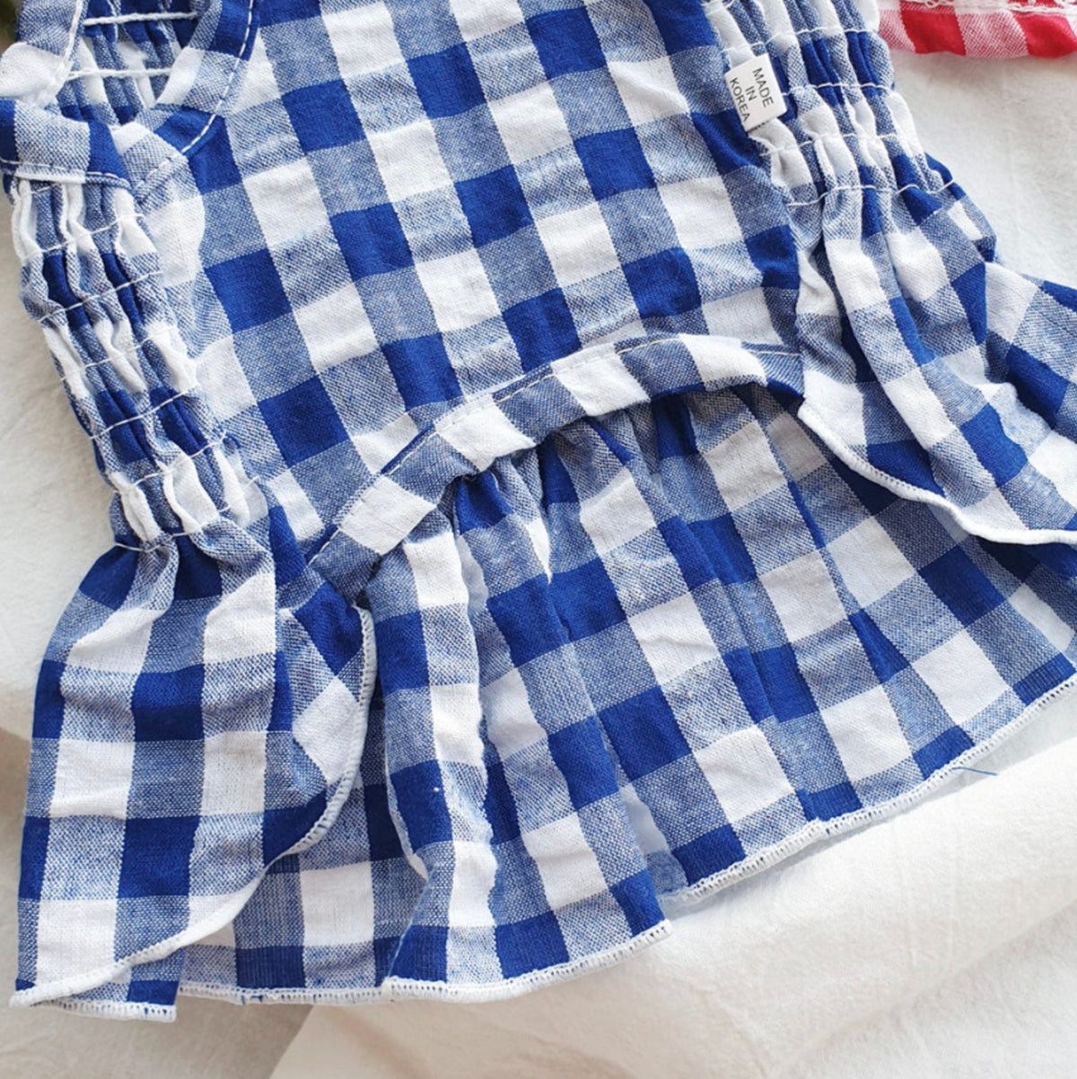 Blue and white gingham smocked dog dress