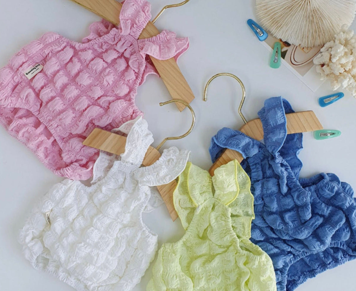 Textured ruffle dog crop tank tops in pink, white, yellow, and blue