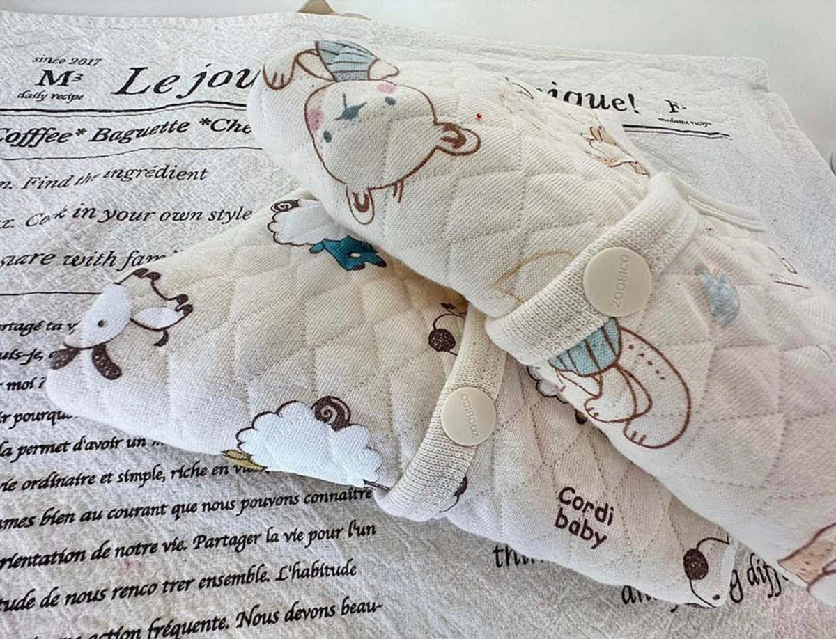 Cream quilted cotton dog vest with cute bear pattern and button detail