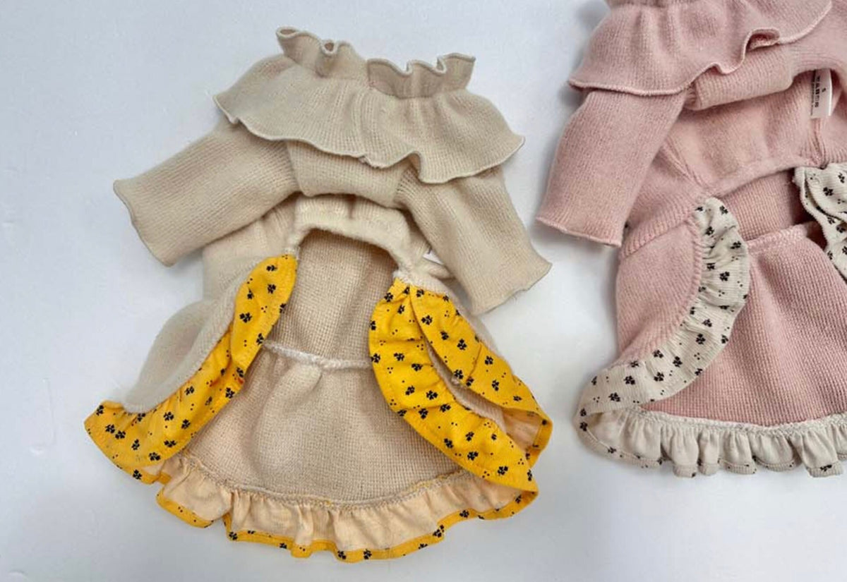 NKpup frilled ribbon dog dresses in cream with yellow floral accents and soft pink.