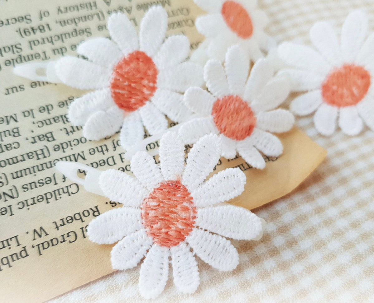 Embroidered white and orange daisy dog hairpins by NKpup