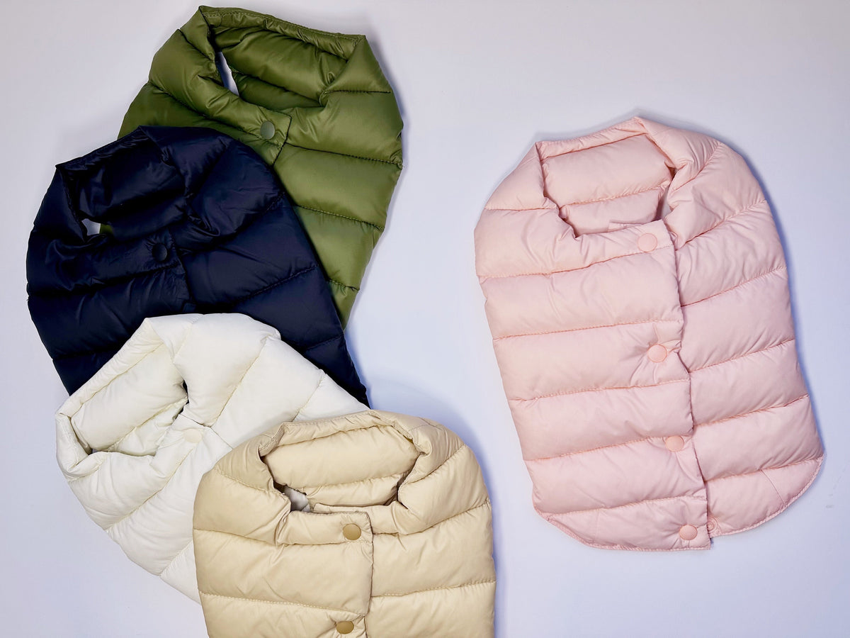 NKpup duck down dog vests in olive green, navy blue, white, beige, and light pink.