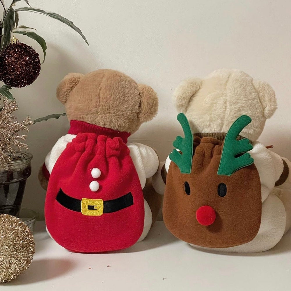 Christmas Santa and Rudolph themed pet backpacks on plush teddy bears