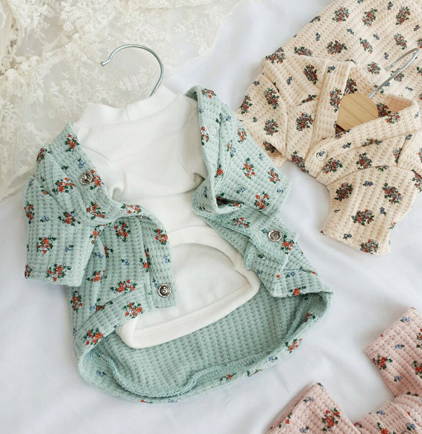 Mint green floral dog cardigan with a waffle texture and button front closure.
