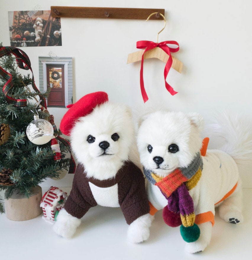 Christmas snowman dog sweatshirt in white and brown with a festive colorful scarf.