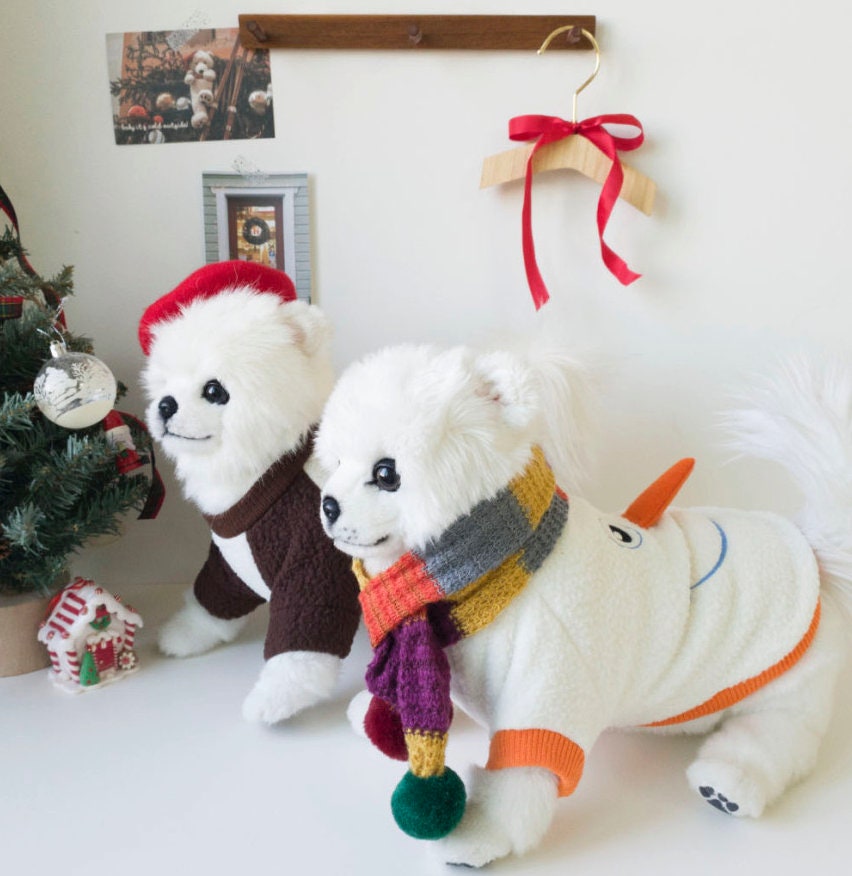 Christmas Snowman Dog Sweatshirt in white with colorful scarf pattern and orange carrot nose detail
