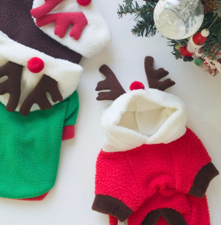 NKpup Reindeer Fleece Dog Hoodies in red and green with plush white hoods and brown antlers