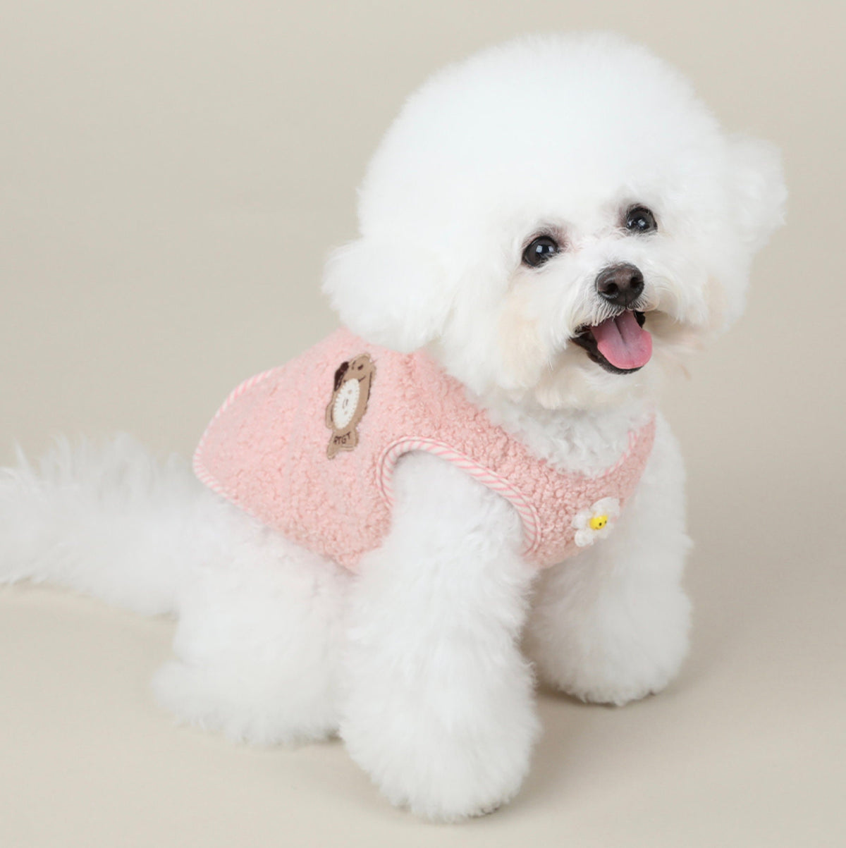 NKpup pink fleece dog vest with a bear patch and daisy detail