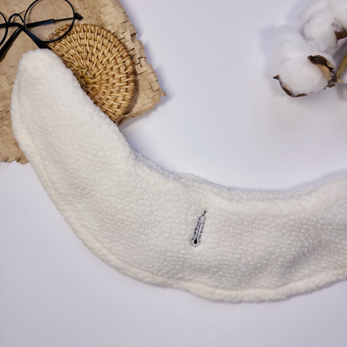 White reversible fleece hoodie cape for pets.