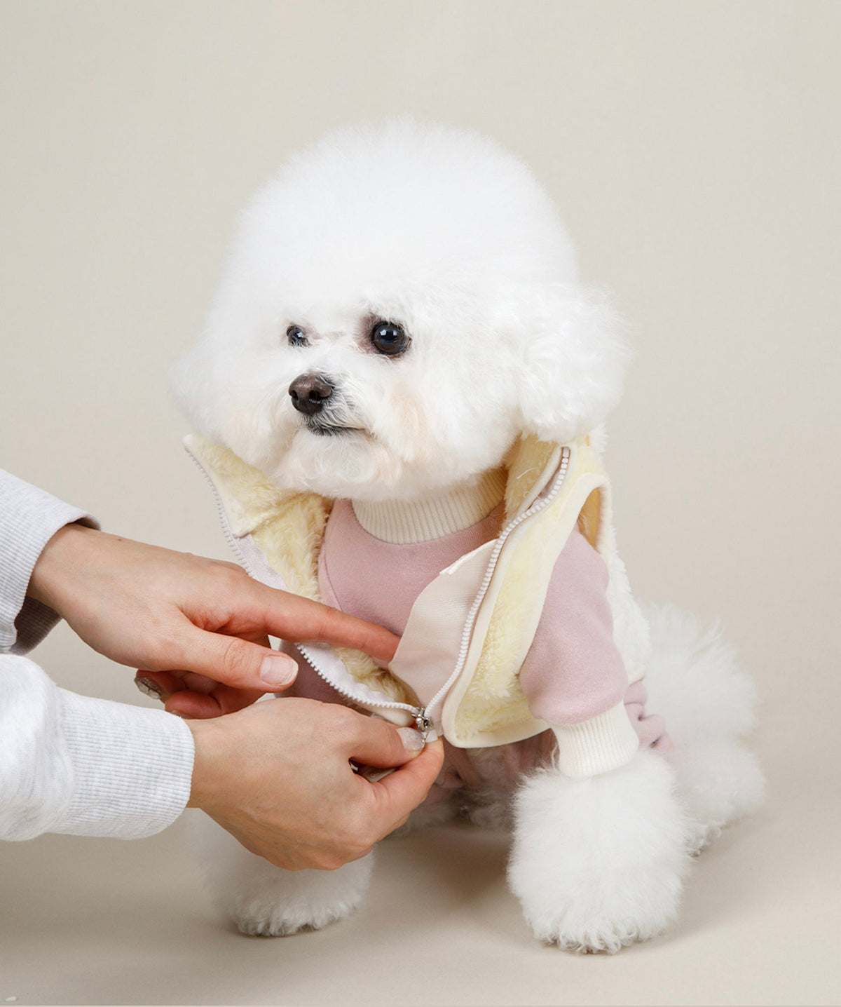 Pink and cream fleece dog vest with a front zipper