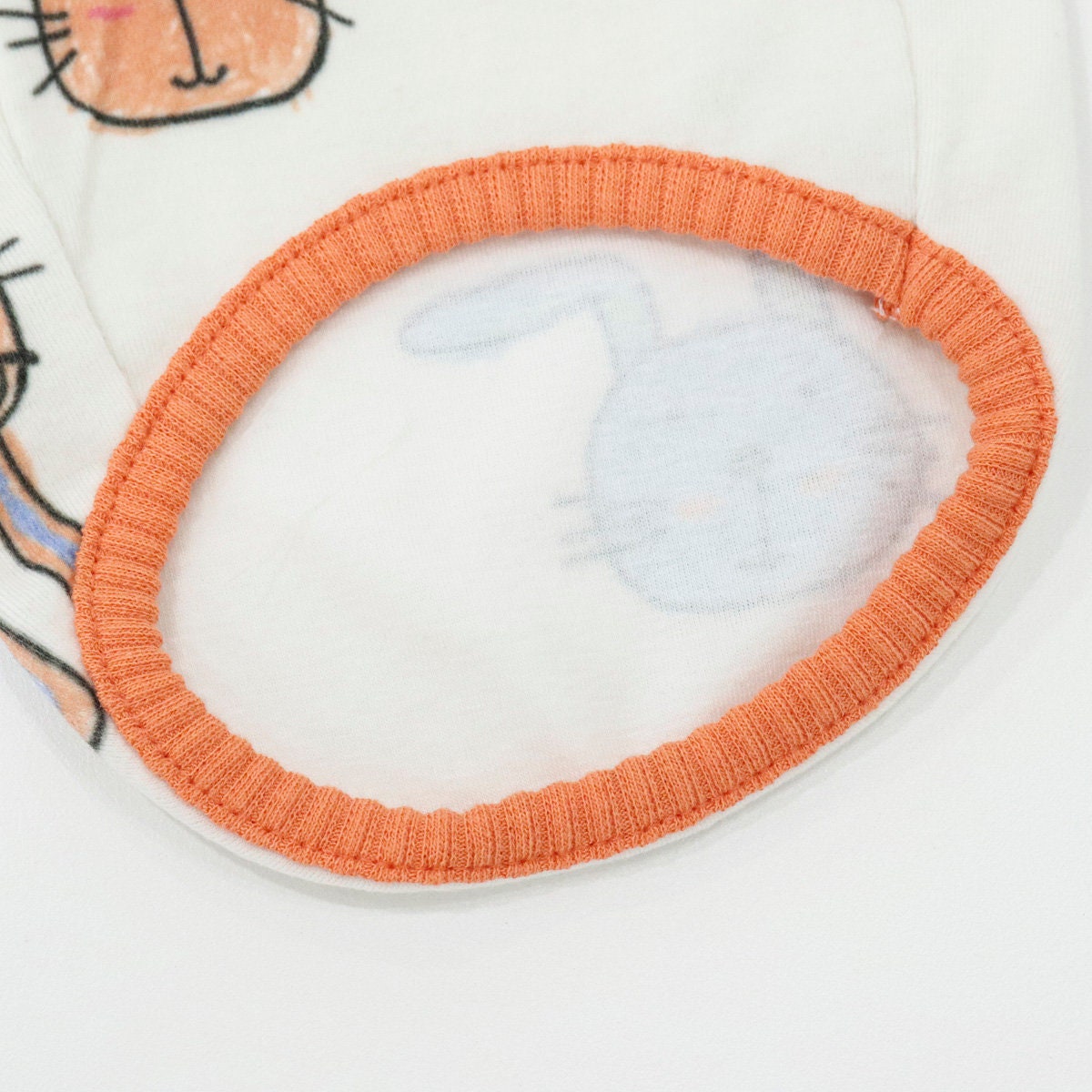 White Rabbit Sleeveless Top for dogs featuring a light blue rabbit print and orange elastic trim.