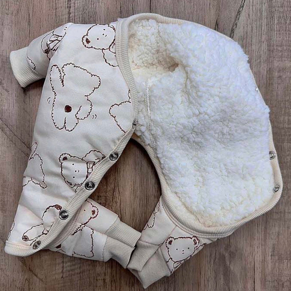 Cream Ribbon Bear Padded Dog Overall with white sherpa lining and bear pattern