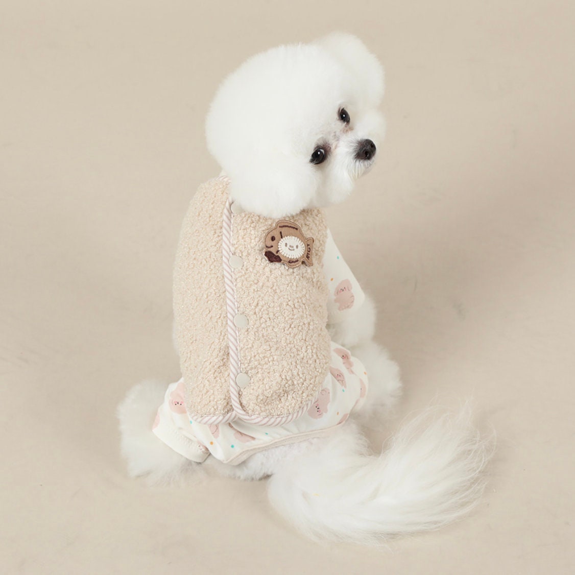 NKpup Daisy fleece dog vest in beige with button details and a small bear patch