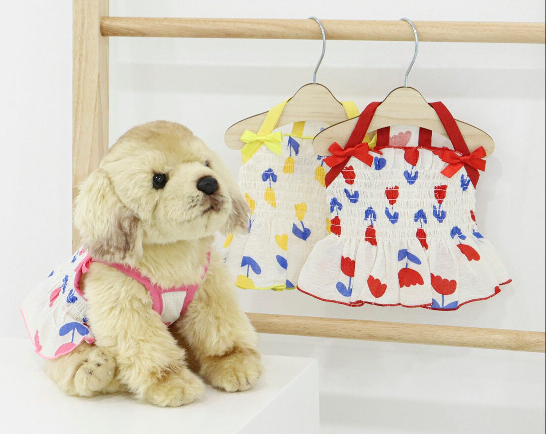 NKpup Tulip Smocked Dog Dress in white with red and blue floral patterns