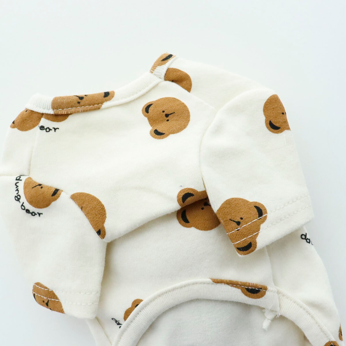 White Bear Pocket Dog Shirt featuring a cute brown bear print pattern.