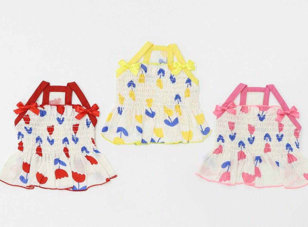 NKpup Tulip Smocked Dog Dresses in red, yellow, and pink floral patterns