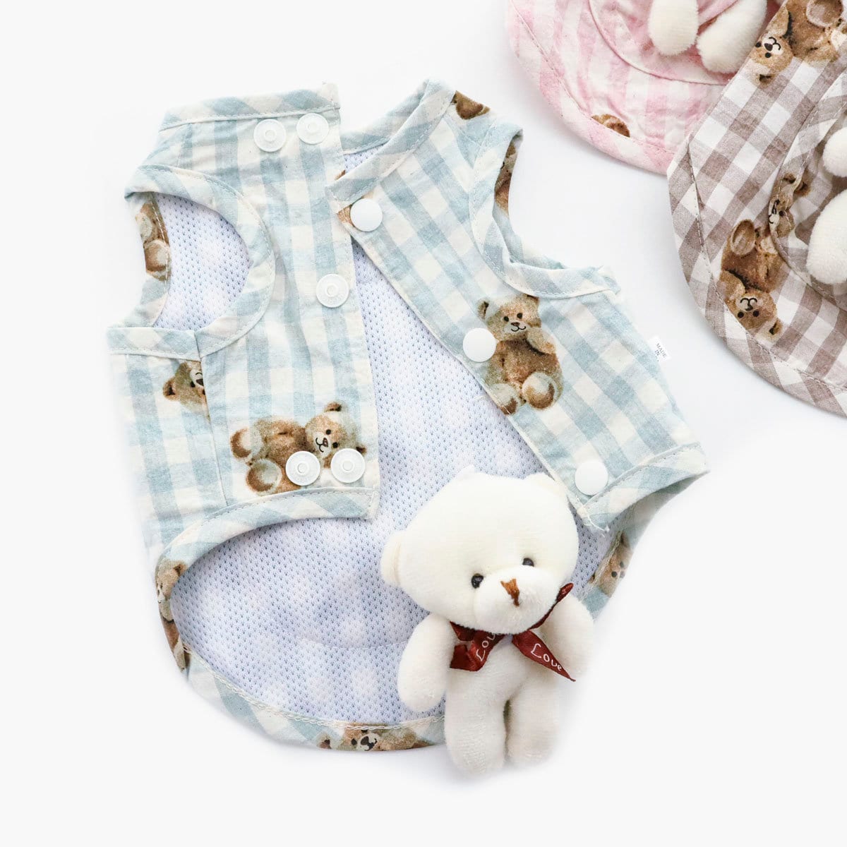 NKpup light blue gingham check dog vest featuring teddy bear patterns and button closures.