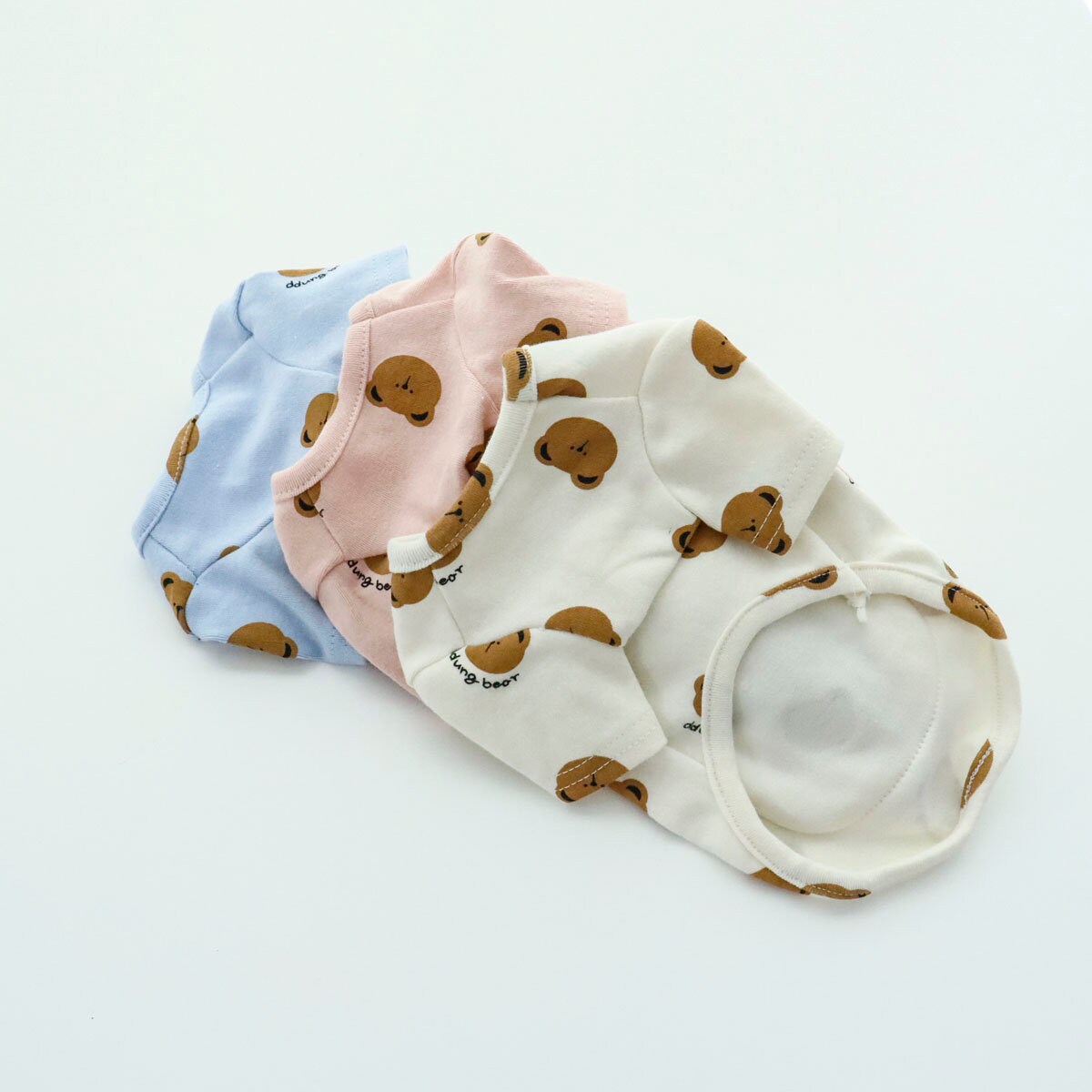NKpup Bear Pocket Dog Shirts in light blue, pink, and cream with cute bear patterns