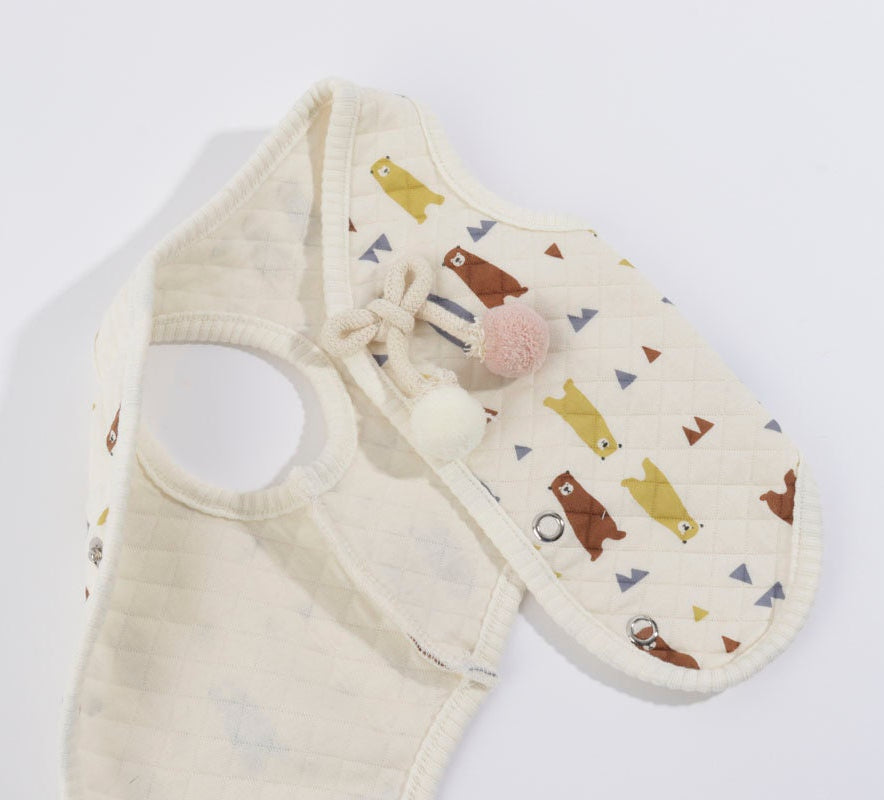NKpup Bear Quilted Dog Vest in cream with bear and triangle patterns and pom-pom accents