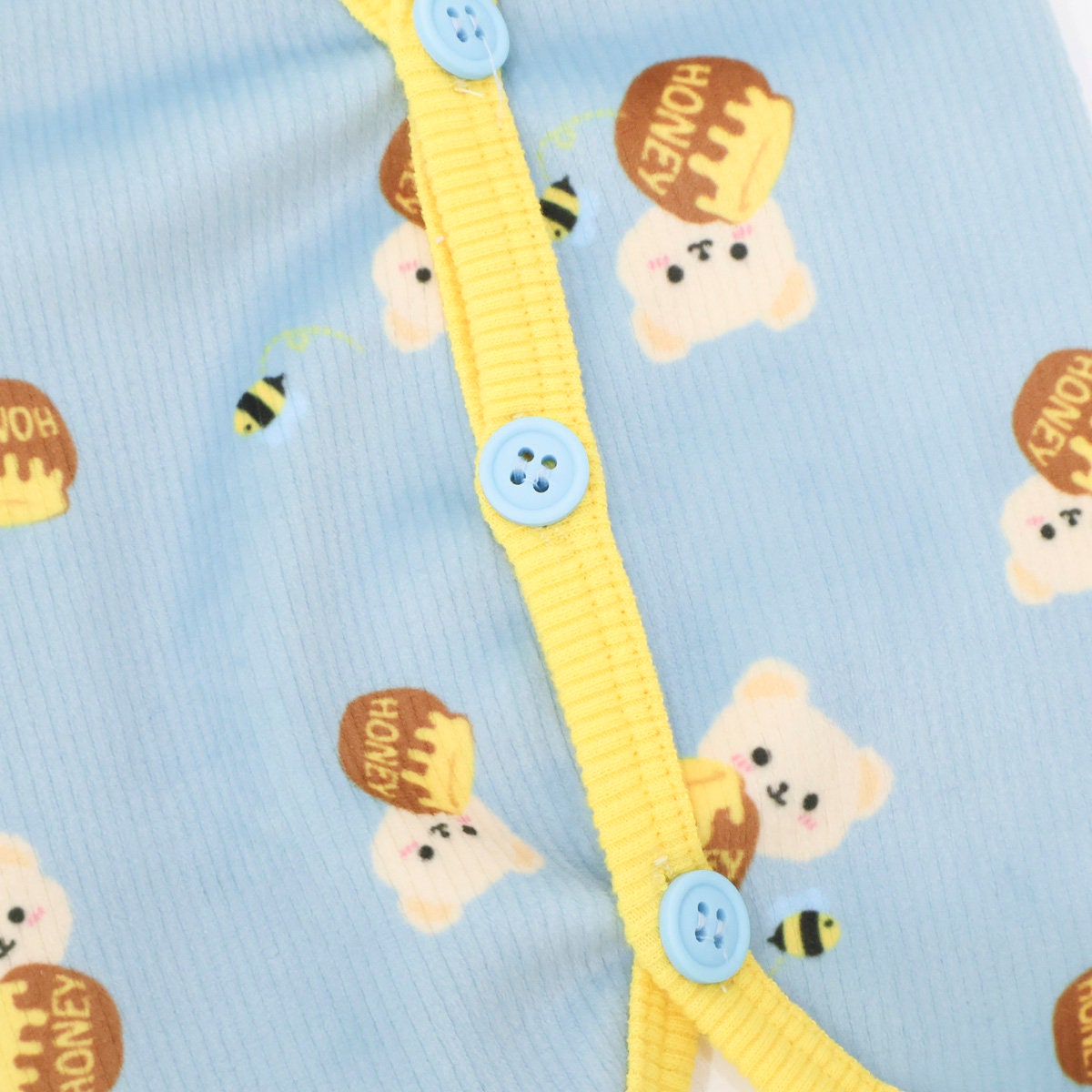 Honey Bear ribbed dog vest in light blue with bear and honey patterns