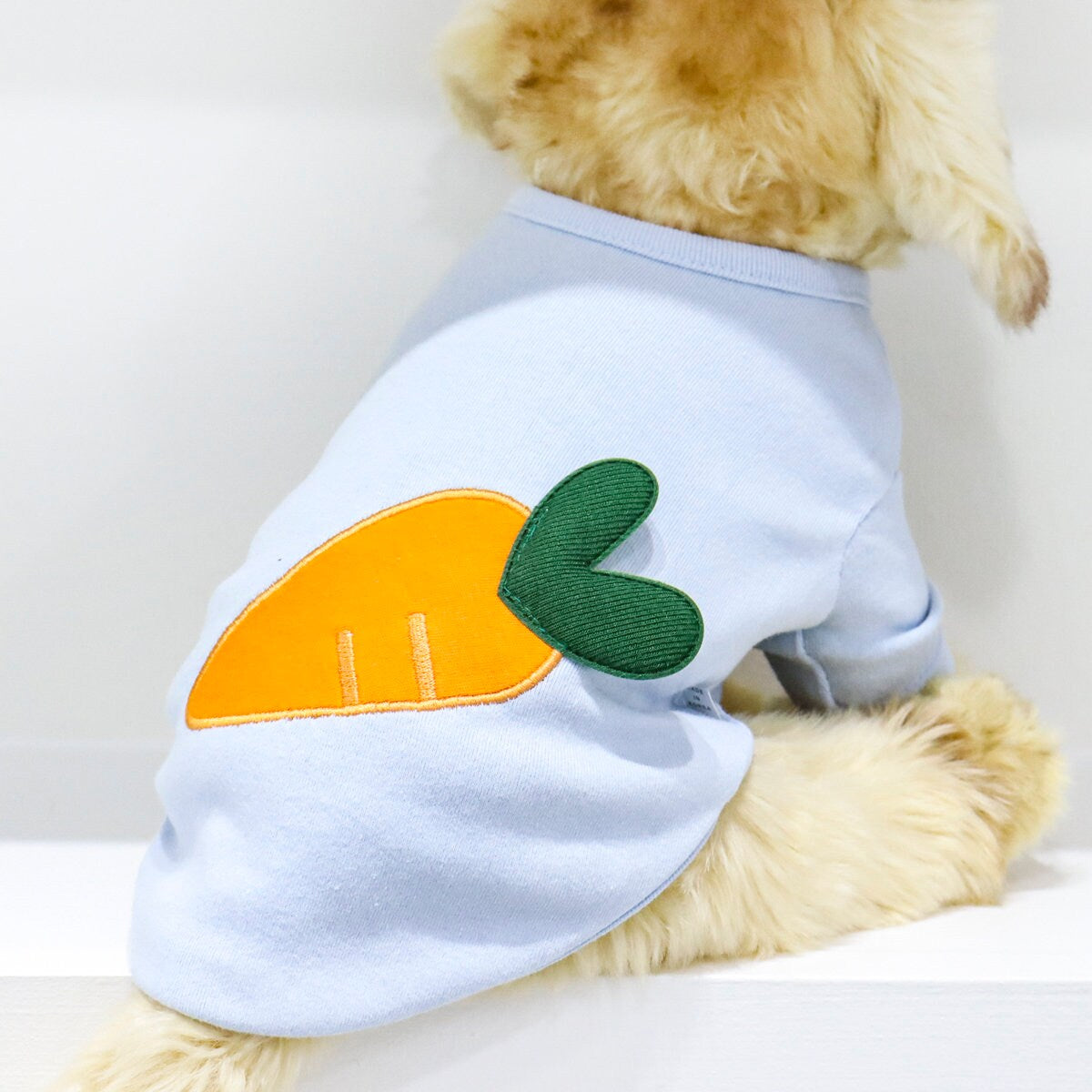 Light blue NKpup Heart Carrot Dog Shirt with an orange heart-shaped carrot patch