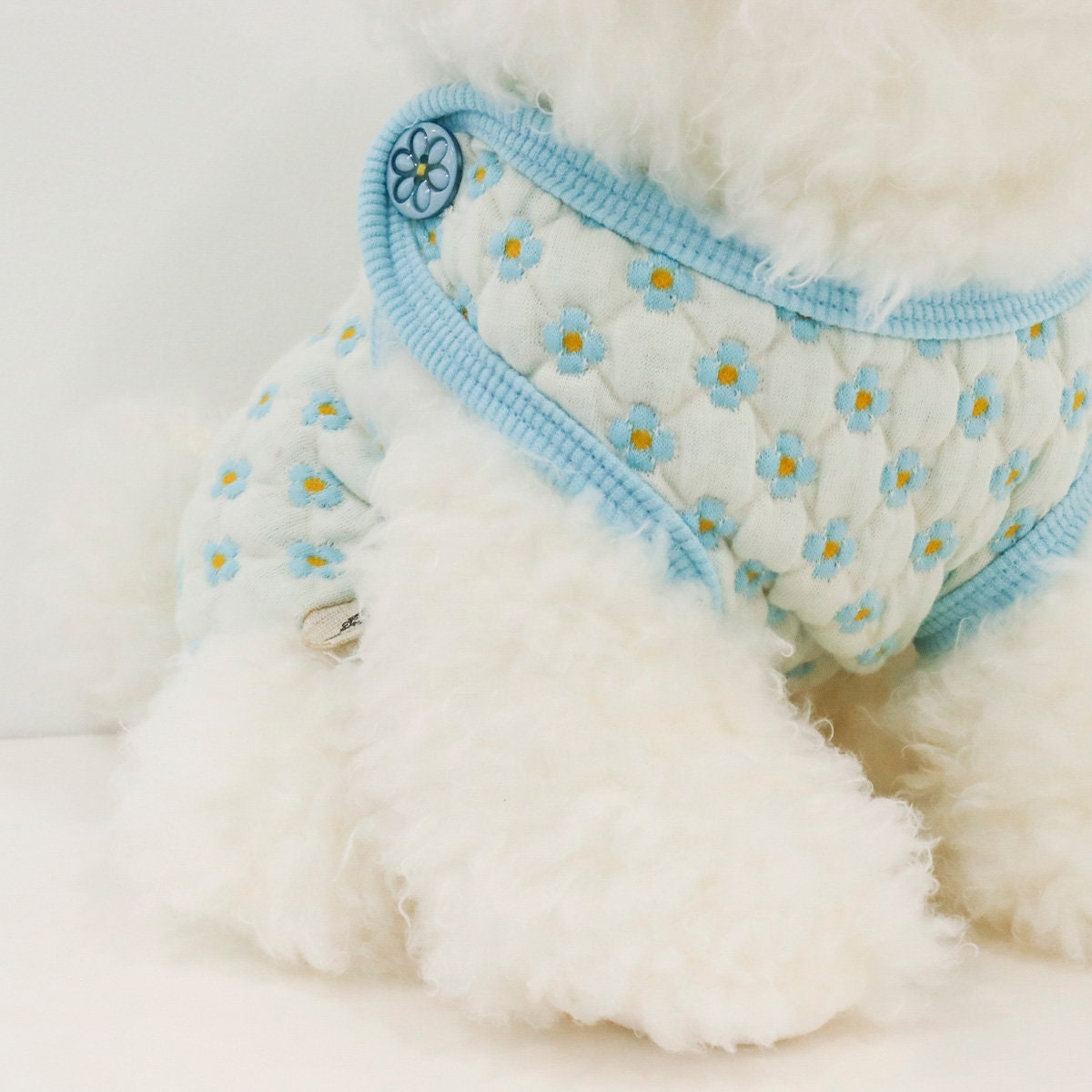 NKpup Daisy Quilted Dog Vest in light blue with white daisy pattern