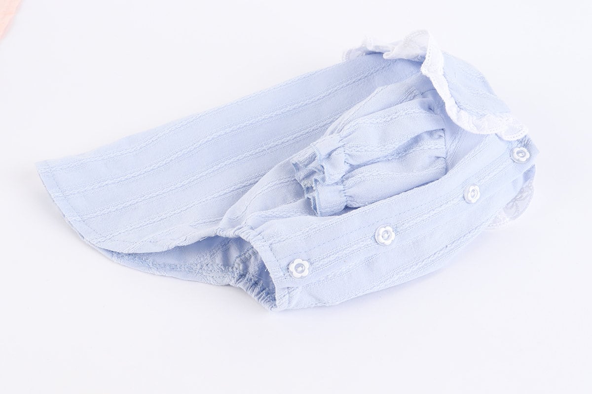 Light blue lace puff blouse for dogs with white lace trim and button details.