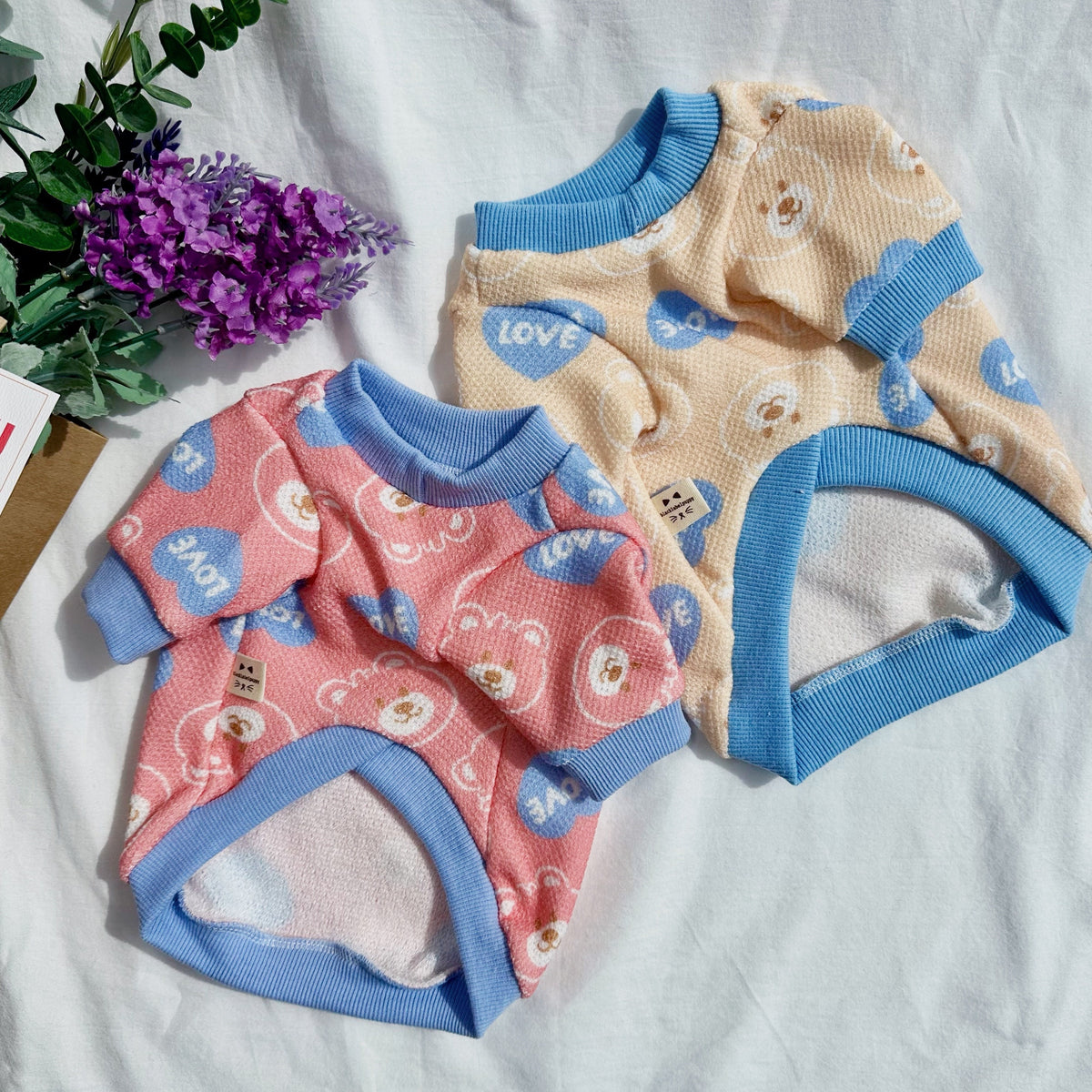 NKpup Love Bear dog shirts in pink and beige with blue trim and teddy bear heart patterns.