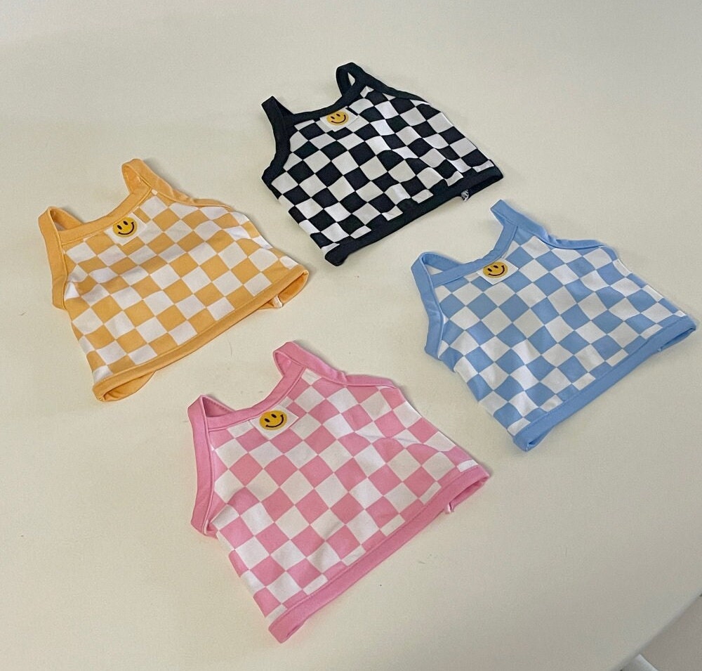 Set of four NKpup cooling check crop top dog shirts in black, yellow, blue, and pink with smiley face details.