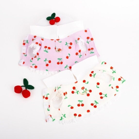 NKpup Cherry Dress Harness in pink and white with cherry patterns and lace trim.