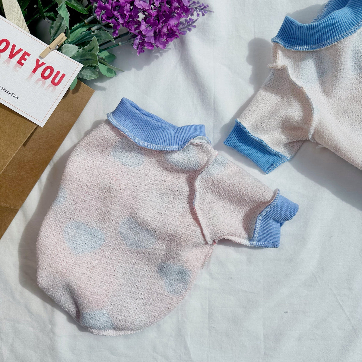 NKpup Love Bear Dog Shirt in light pink with blue heart patterns and blue ribbed trim