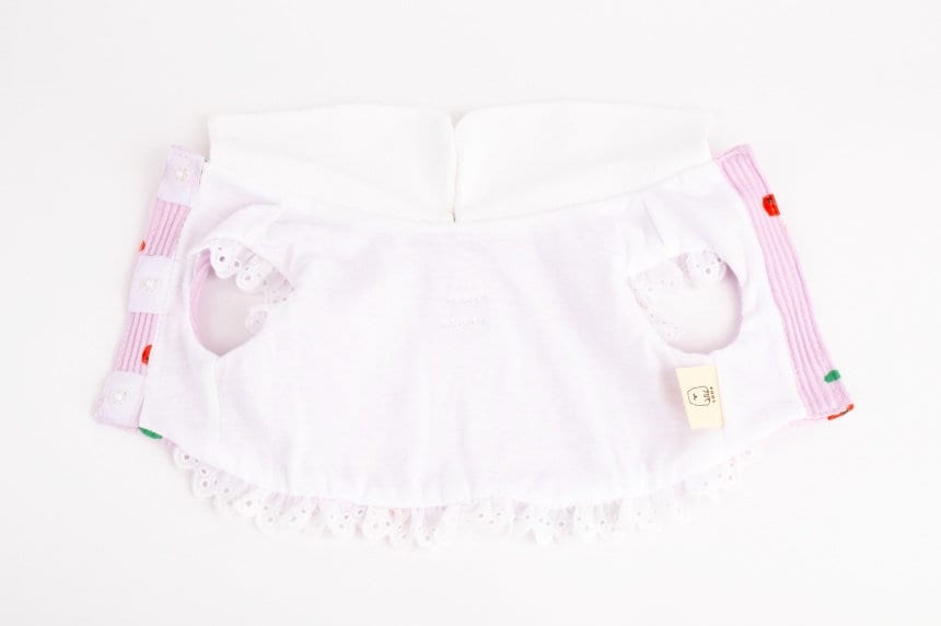 NKpup Cherry Dress Harness in light pink with white lace trim and cherry patterns.
